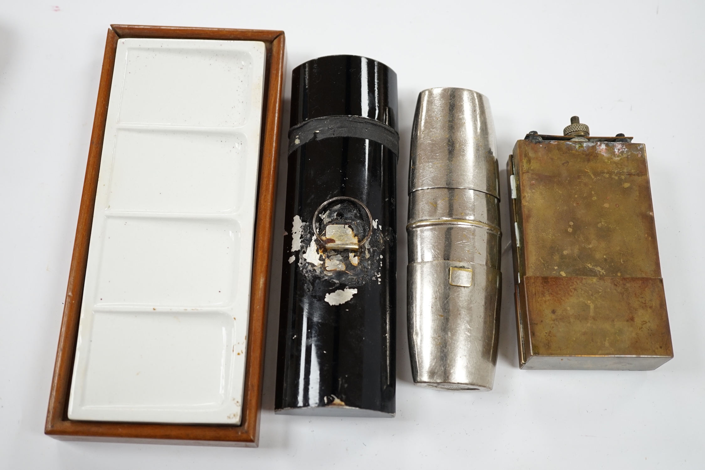 A Winsor & Newton travelling paint box and three others. Condition - fair